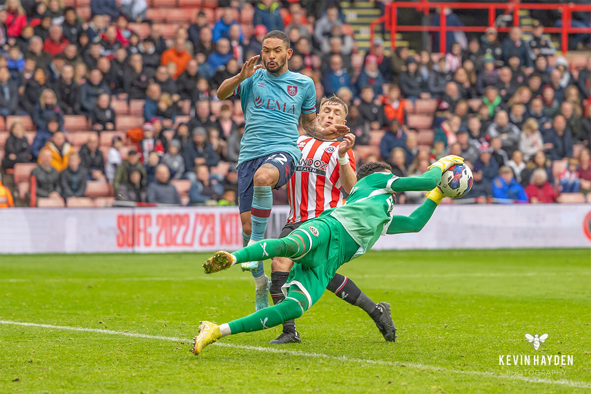 Sheffield United's Wes Foderingham cuts out the cross in front of Burnley's Vitinho at Bramhall Lane, Sheffield . Photo by Kevin Hayden.