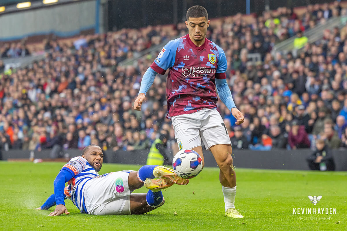 Burnley's Anass Zaroury gets tackled by a Reading player at Turf Moor, Burnley. Photo by Kevin Hayden.