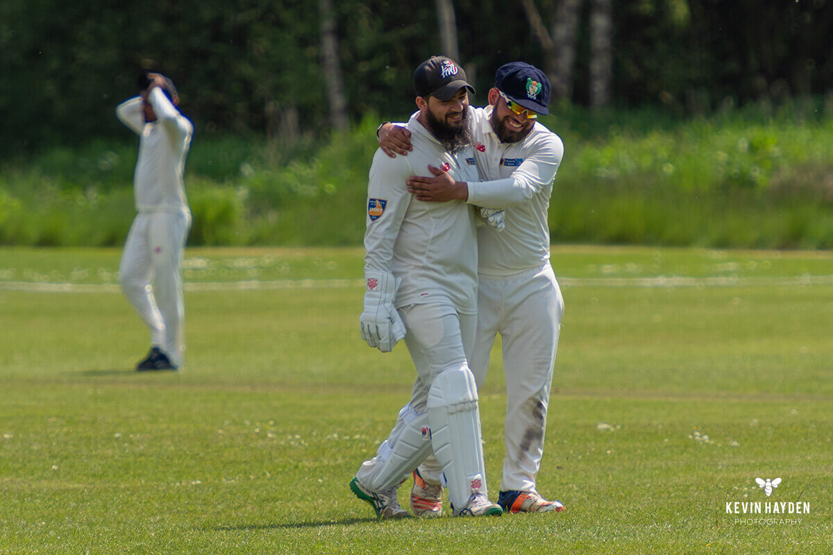 The Bolton wicket keeper and first slip share a moment, University of Bolton v University of Chester cricket match. Photo by Kevin Hayden.